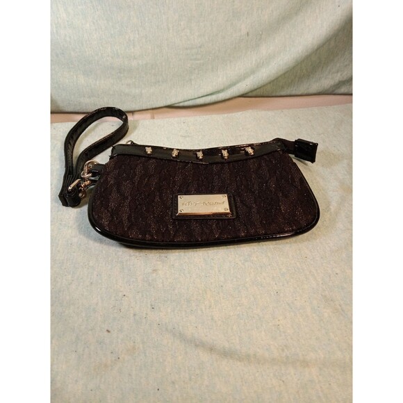 Betsey Johnson Wristlet with shimmery black lace pattern, 5 girl skulls, heart - Picture 1 of 3